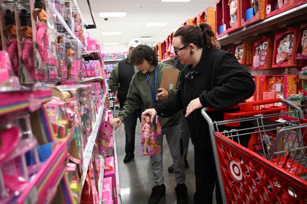 Matthias Slenbaker shops with Saturday, Dec. 6, 2025,  at Target in Allentown during Shop with an Airport Cop.(Amy Shortell/The Morning Call)