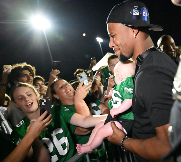 Saquon Barkley interacts with fans as he is inducted into the Whitehall Hall of Fame on Friday, Sept. 5,2025, at halftime during a Whitehall High School football game in Whitehall Township. (Amy Shortell/The Morning Call)