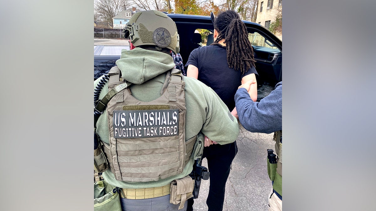 US Marshals taking Tyvine Jones into custody