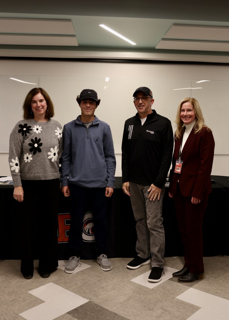 Image of BOE President Holly Dellenbaugh, Jonathan Lazarek, Coach Steve Smith and Superintendent Jody Monroe
