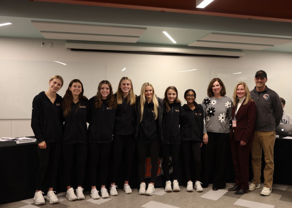 Image of girls cross country team, BOE President Holly Dellenbaugh, Superintendent Jody Monroe and Coach Tucker Chrapowitzky