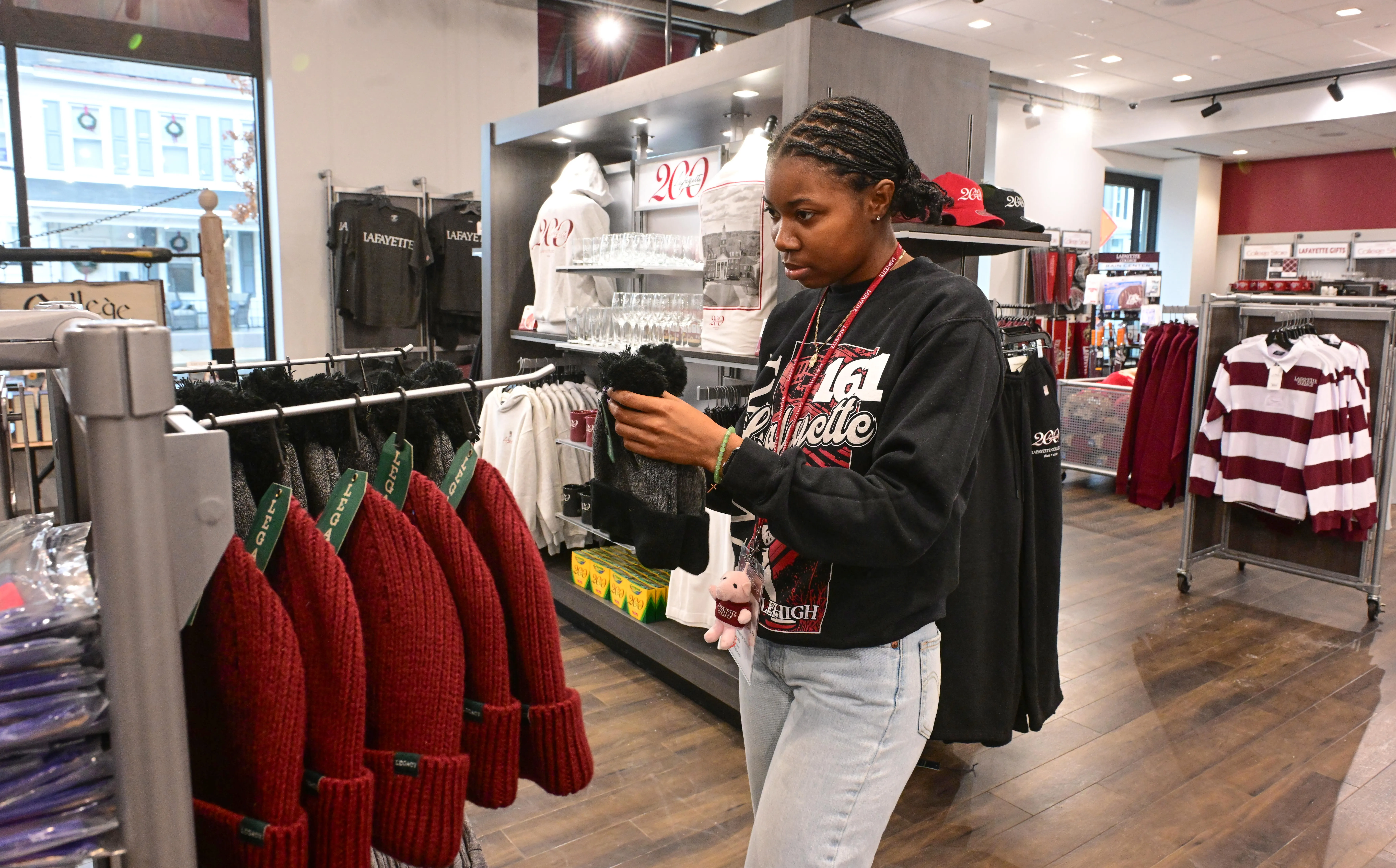 Jasmine Williams, a Lafayette College senior, arranges items Friday, Dec....