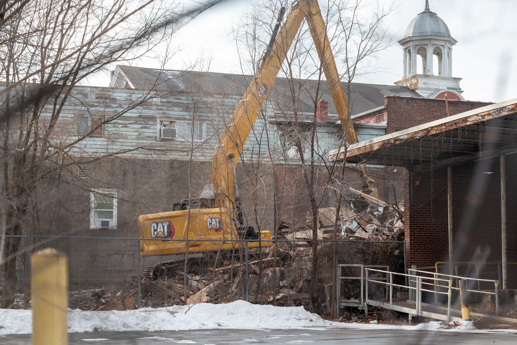 Part of West Side Hotel razed following December fire