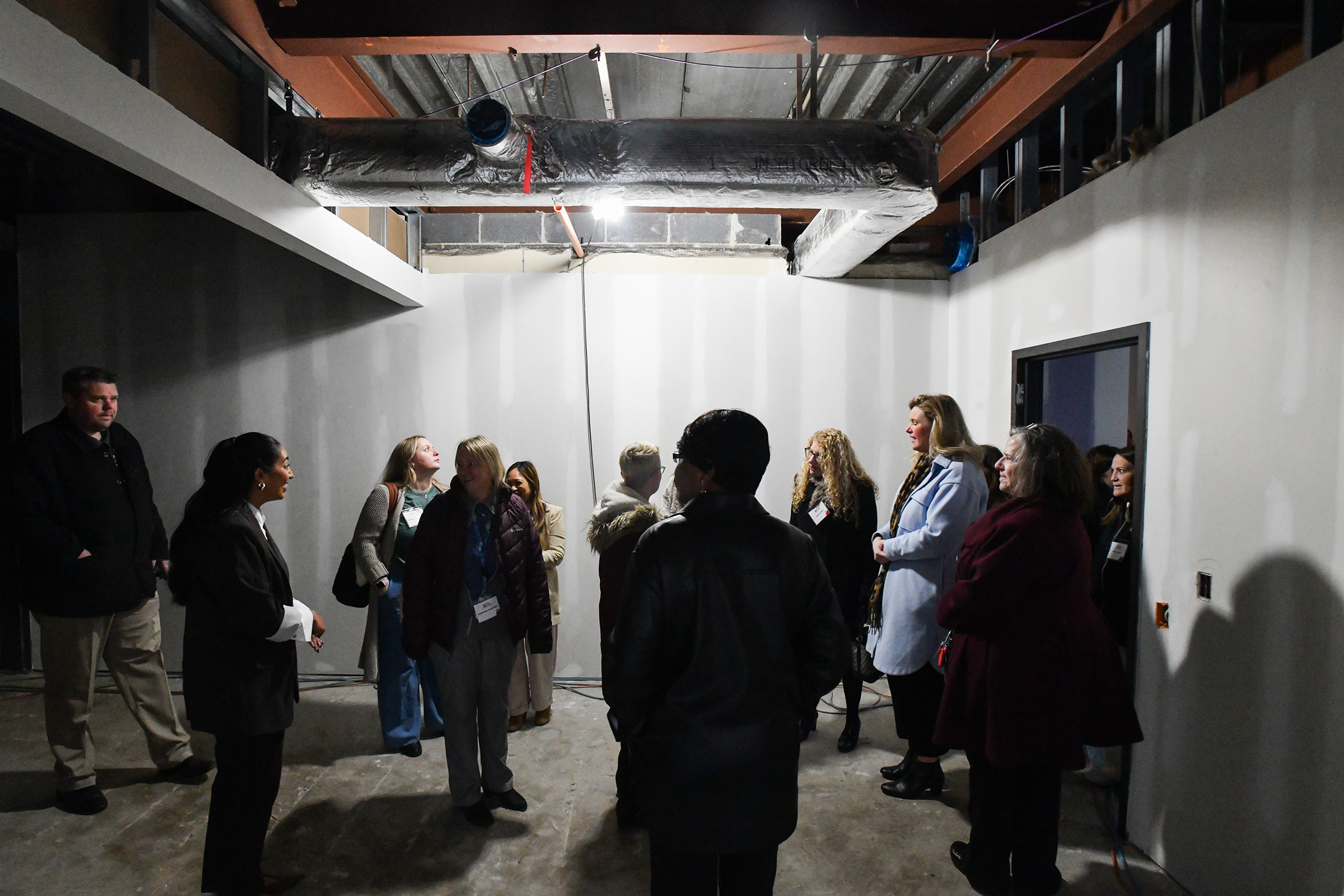 People tour the entrance where parents will drop off their...