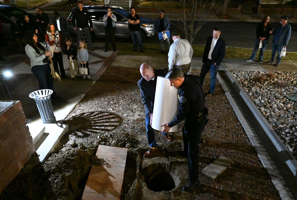 Erie leaders look ahead as time capsule is buried at renovated Town Hall