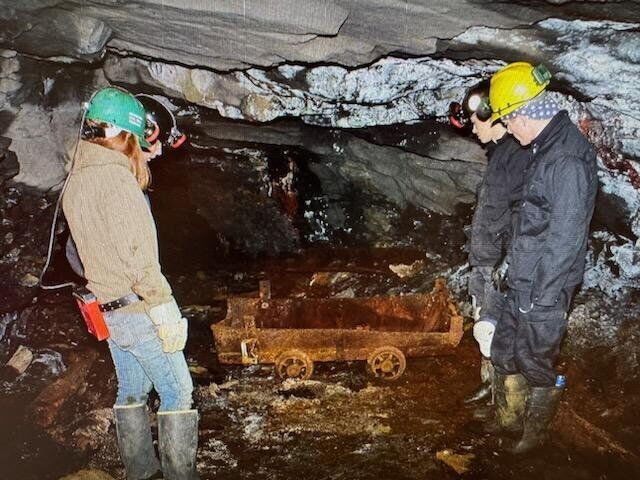 Underground Miners members inspect a long-abandoned coal car or “bogie...