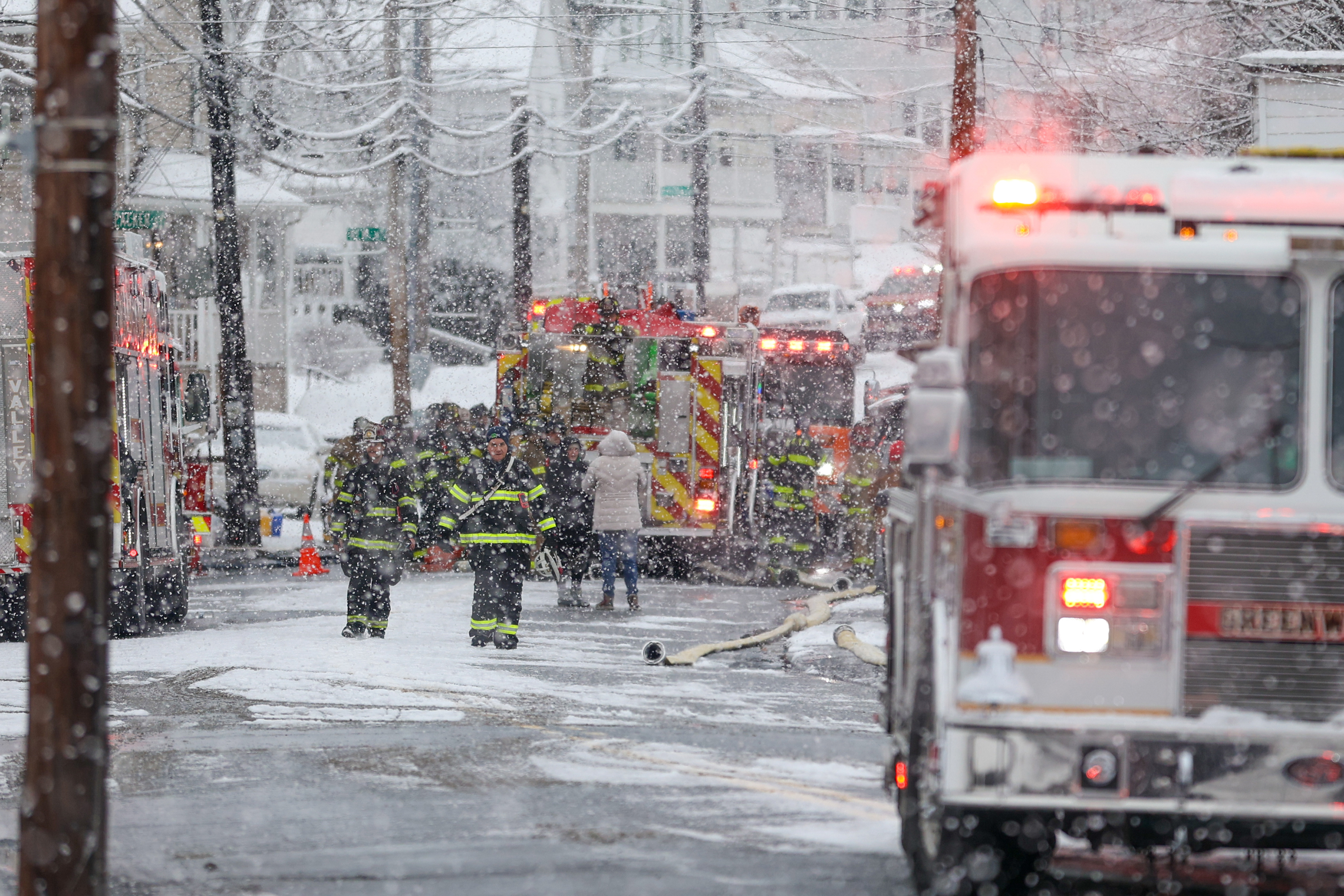 Firefighters work the scene at 628-630 McAlpine St. in Avoca...