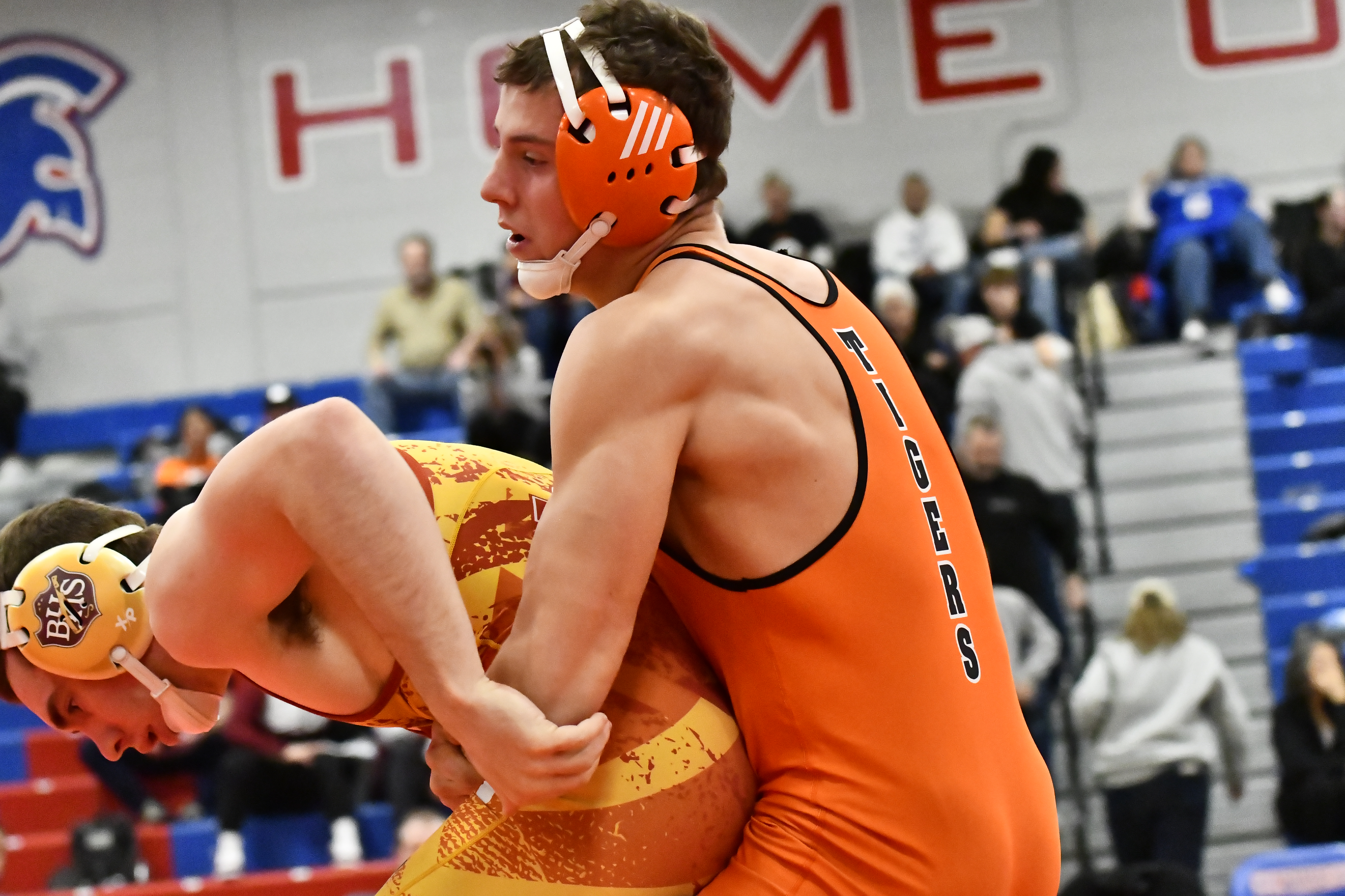Erie's Tyler Muir, right, wrestles against Brush's Austin Ley on...