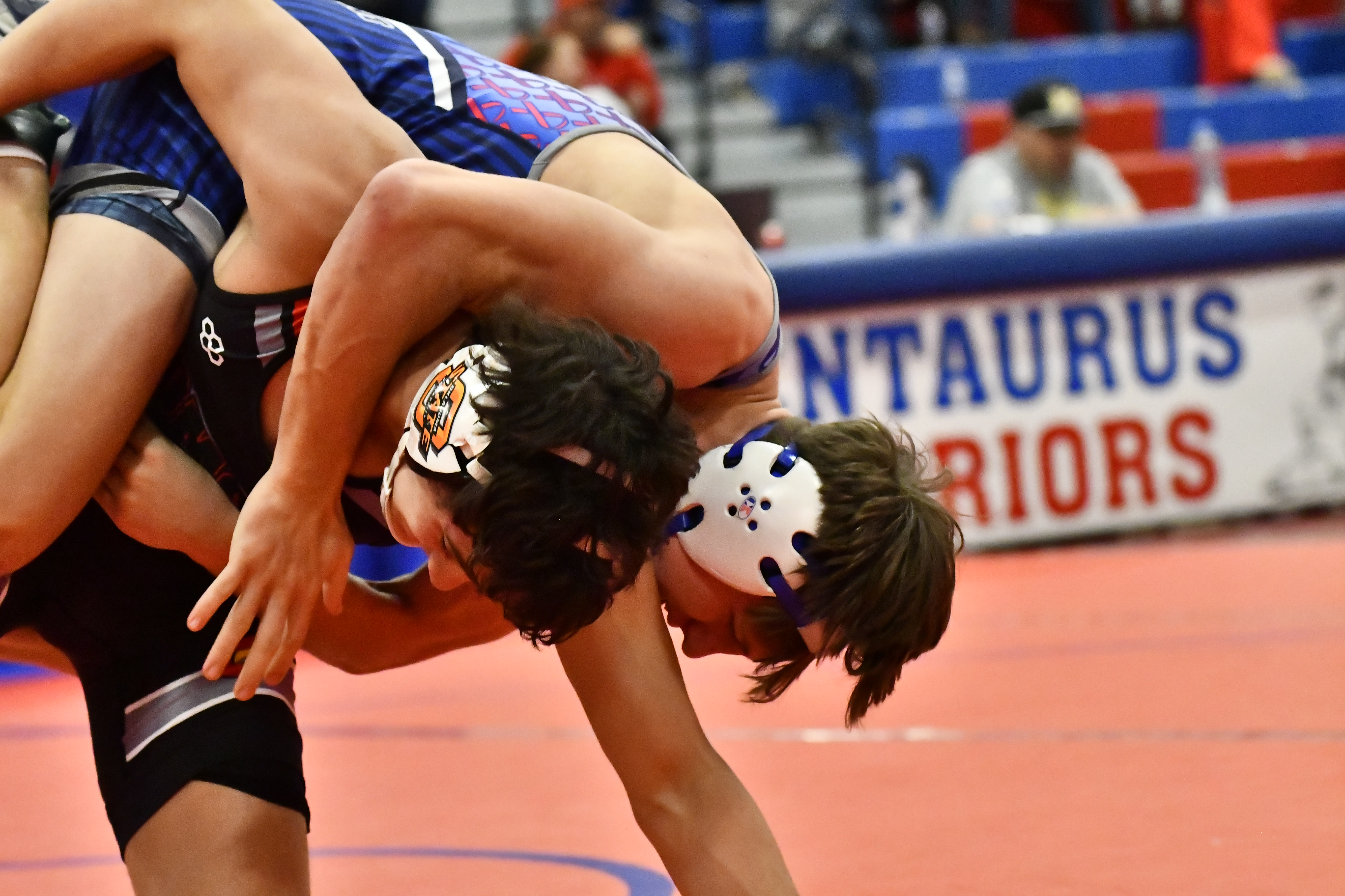 Broomfield's Nick Penfold wrestles against Pomona's Donovan Symalla during the...