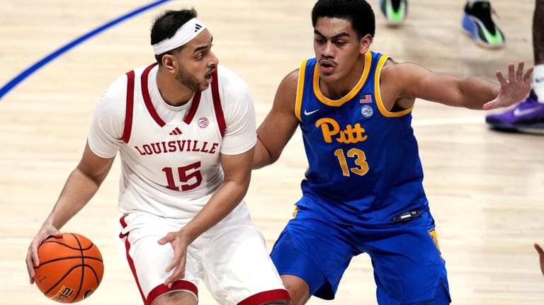 Louisville center Aly Khalifa (15) looks to pass with Pittsburgh...