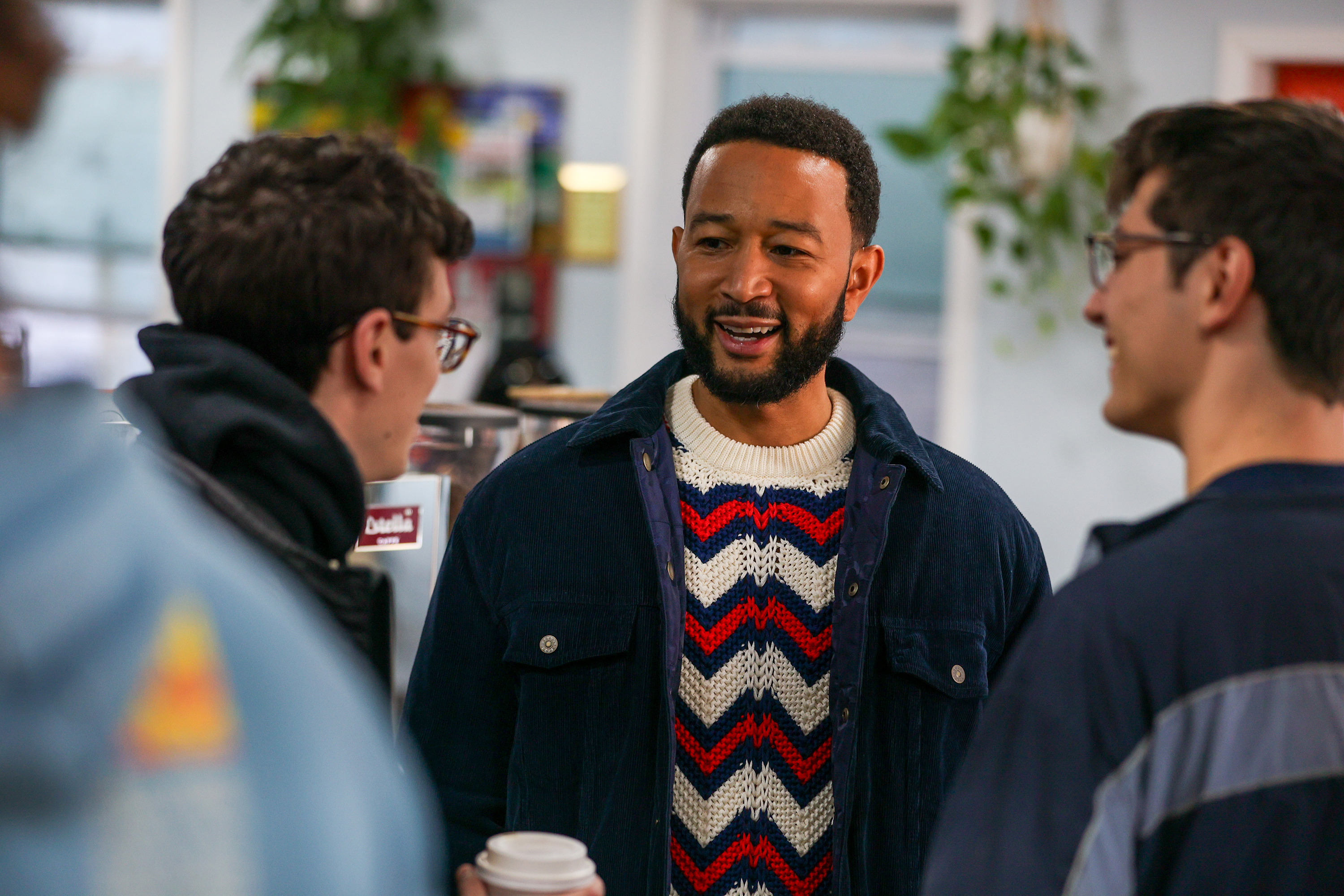 John Legend chats with patrons of the Retro Cafe in...