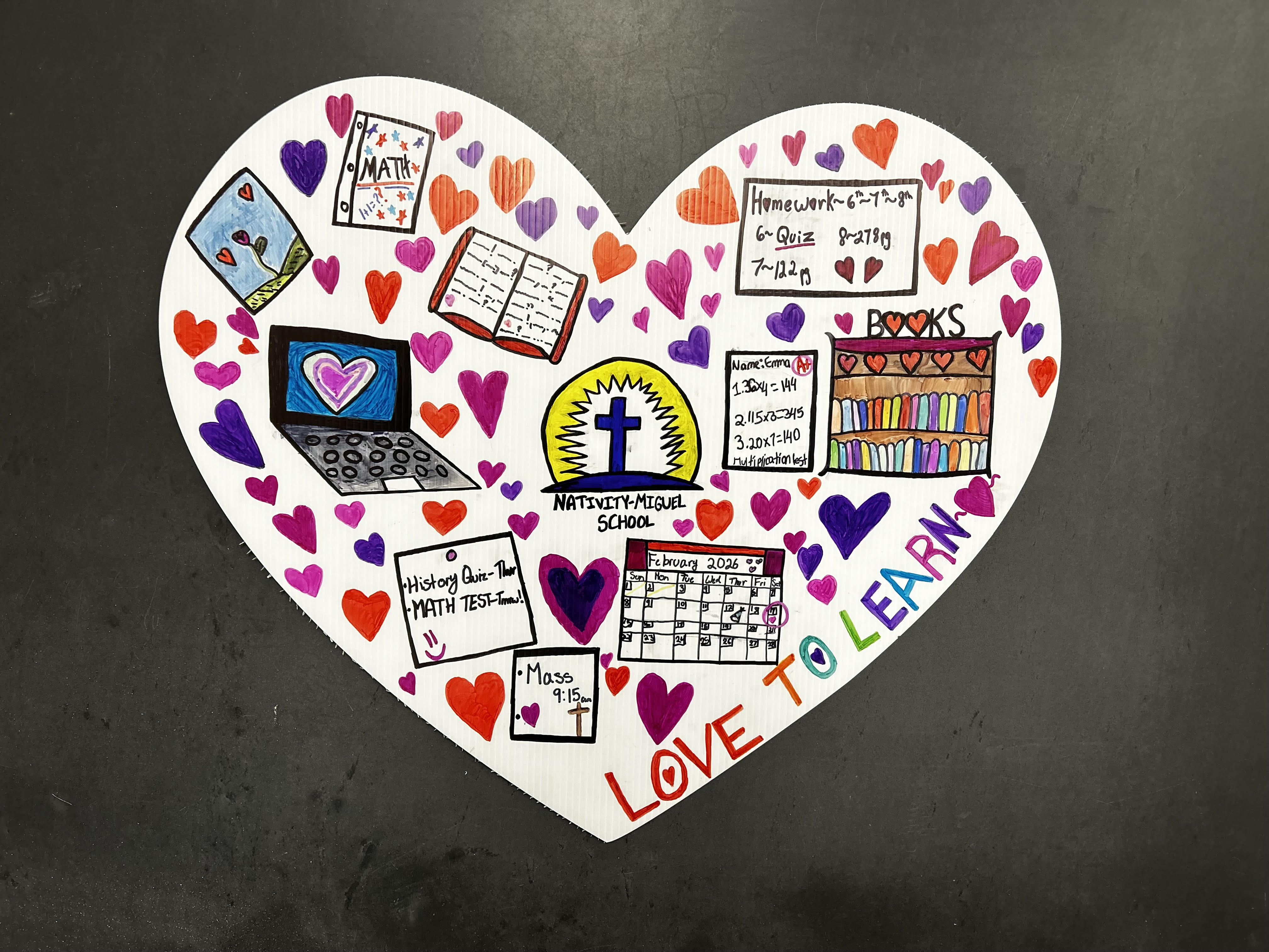 A large valentine heart featuring artwork by students of the...