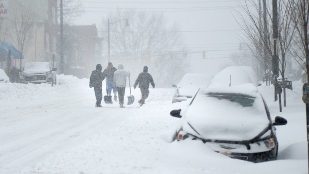 Shovelers make their way down Hamilton Street in Allentown during the Blizzard of 2016 on Saturday, Jan. 23, 2016. (Chris Shipley/The Morning Call)