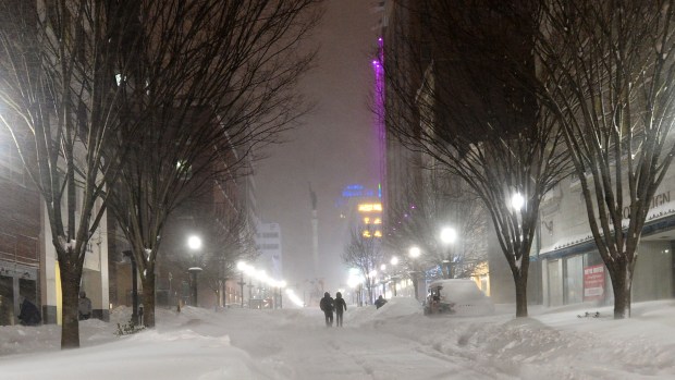 On Hamilton Street in downtown Allentown, night falls and snow drifts steadily get bigger during the Blizzard of 2016 on Saturday, Jan. 23, 2026. (April Bartholomew/The Morning Call)