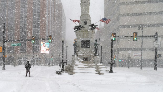 People try to cross snow drifts at Seventh and Hamilton streets in downtown Allentown on Saturday, Jan. 23, 2016, during the Blizzard of 2016. (April Bartholomew/The Morning Call)