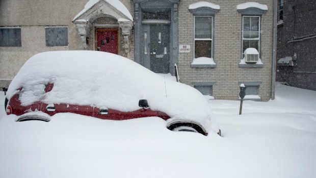 A car on West Turner Street in Allentown is buried in snow during the Blizzard of 2016 on Saturday, Jan. 23, 2016. (Chris Shipley/The Morning Call)