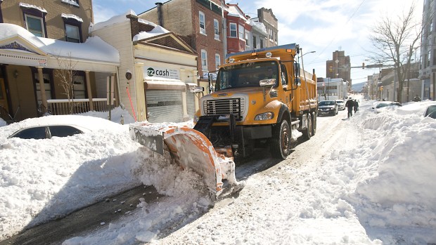 A snow plow operates on North Sixth Street in Allentown on Sunday, Jan. 24, 2016, as Lehigh Valley residents dug out from the Blizzard of 2016. (Harry Fisher/The Morning Call)