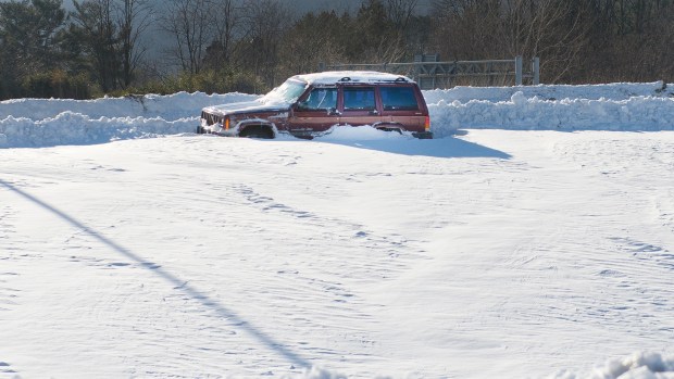 A stranded vehicle waits to be dug out at the Interstate 78 and Route 309 interchange in Upper Saucon Township on Sunday, Jan. 24, 2016, a day after the Blizzard of 2016 dumped more than 30 inches of snow on the Lehigh Valley. (Chris Shipley/The Morning Call)