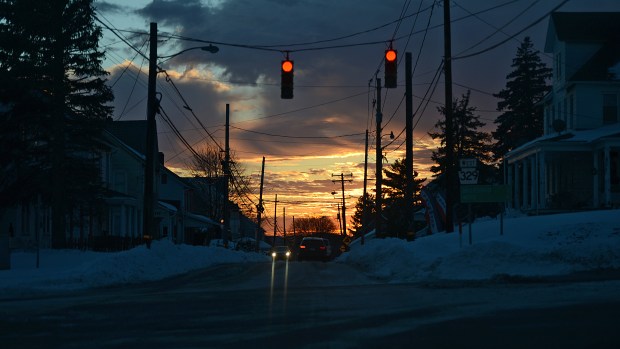 The sun sets over Route 329 in Whitehall Township on Sunday Jan. 24, 2016, after Lehigh Valley residents spent the day digging out from the Blizzard of 2016. The storm dumped a record 31.9 inches of snow on the region. (Emily Paine/The Morning Call)