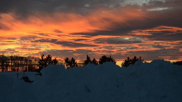 The sky fills with color as the sun sets in Whitehall Township on Sunday Jan. 24, 2016, after Lehigh Valley residents spent the day digging out from the Blizzard of 2016. The storm dumped a record 31.9 inches of snow on the region. (Emily Paine/The Morning Call)