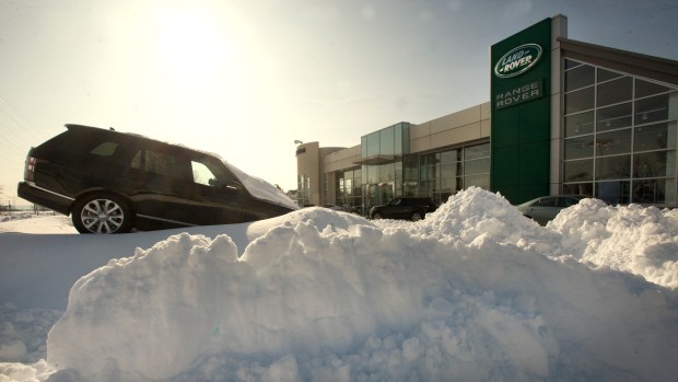 The lot of Bennett Land Rover Jaguar was still a series of snow piles, as employees worked to clear the lot along Tilghman Street in South Whitehall Township on Monday morning Jan. 25, 2016, after the Blizzard of 2016 hit the Lehigh Valley. (Harry Fisher/The Morning Call)