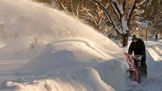 Paul Leaser begins the tedious process of clearing snow away from his completely covered vehicle along the 2700 block of Greenleaf Street in Allentown as Lehigh Valley residents dig out in the Blizzard of 2016's aftermath on Sunday, Jan. 24, 2016. (Harry Fisher/The Morning Call)