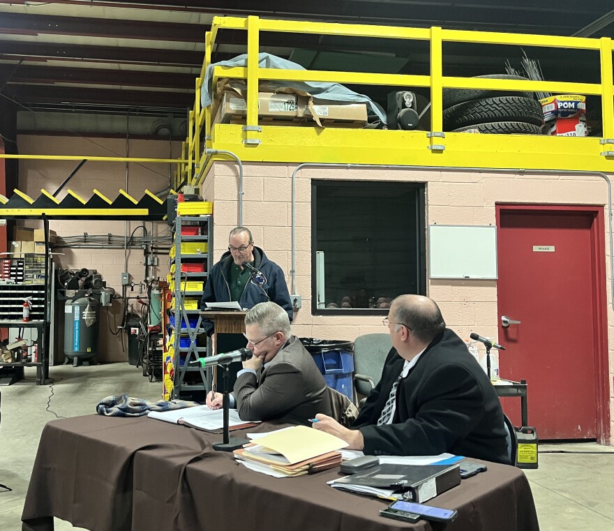 Ransom Twp. Planning Commission Chair James Murphy gives testimony during a zoning hearing. Todd Johns and Justin Sulla, attorneys for Scranton Materials LLC who plan to build a data center in the township, sit in front.