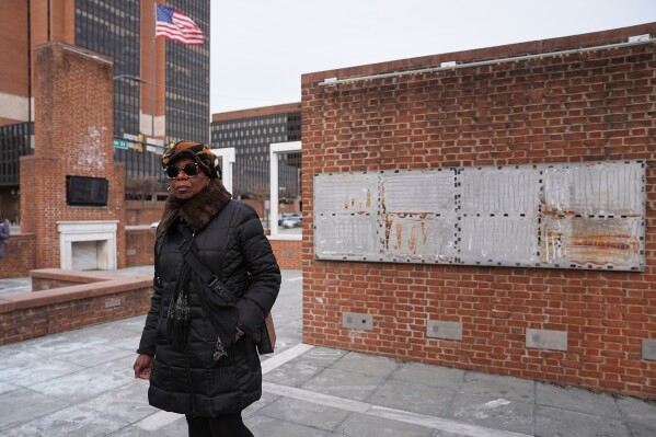 Karen Oliver walks by the locations of a now removed explanatory panels that were part of an exhibit on slavery at President's House Site in Philadelphia, Friday, Jan. 23, 2026. (AP Photo/Matt Rourke)