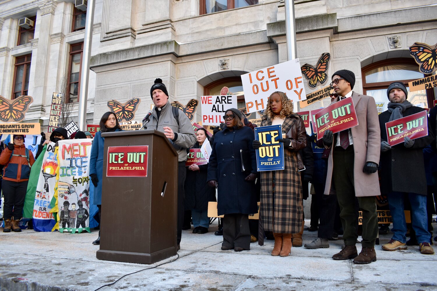 The Rev. Thomas M. Higgins, of Holy Innocents Parish, speaks at an event announcing the introduction of the "ICE Out" legislation Tuesday, Jan. 27, outside City Hall.