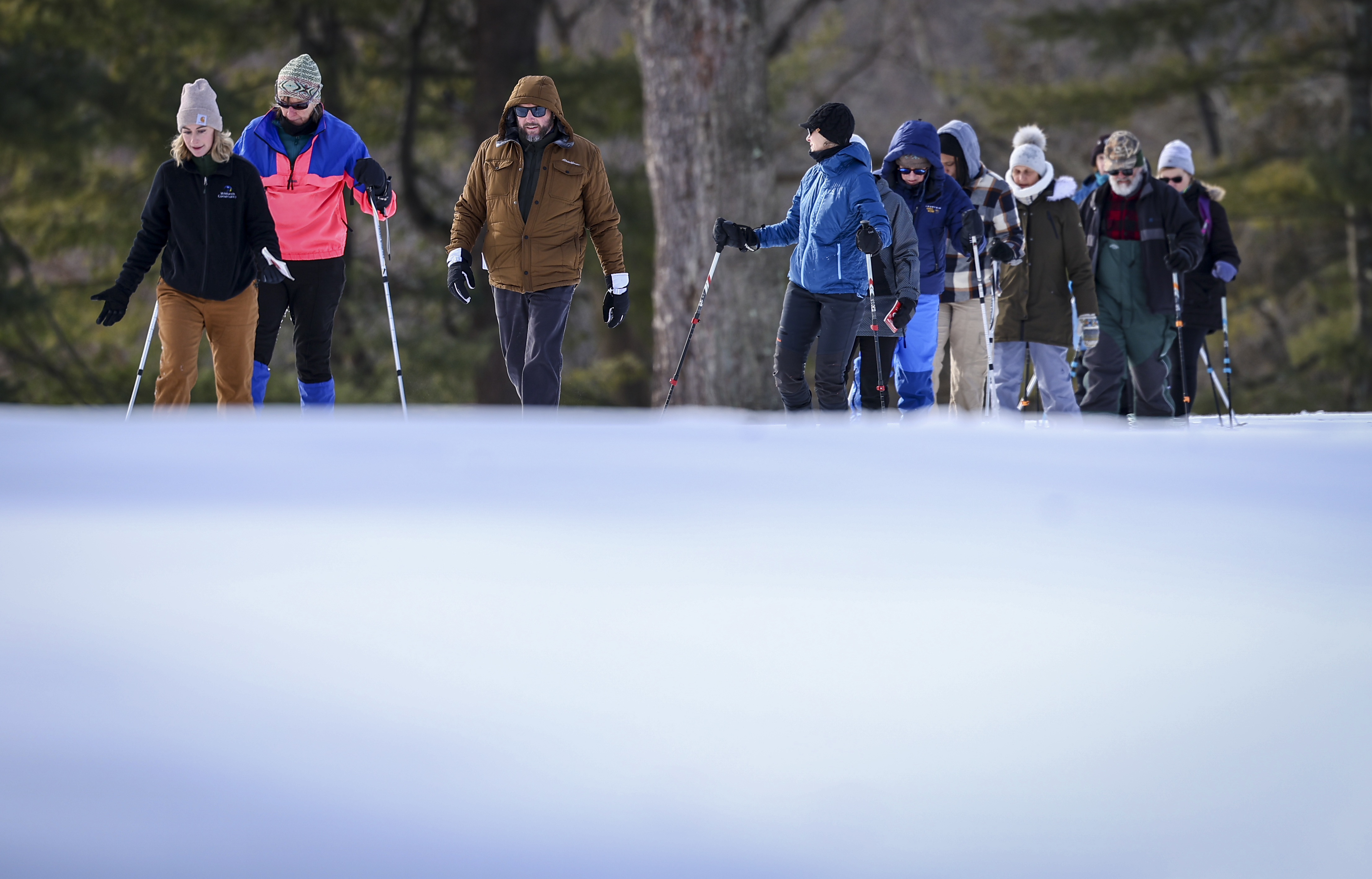 Nicole Landis, Senior Community Engagement Specialist with Wildlands Conservancy, left, eads a Winter Wildlife Snowshoe excursion Wednesday, Jan. 28, 2026, through Janet Johnston Housenick and William D. Housenick Memorial Park and Archibald Johnston Conservation Area in Bethlehem Township.