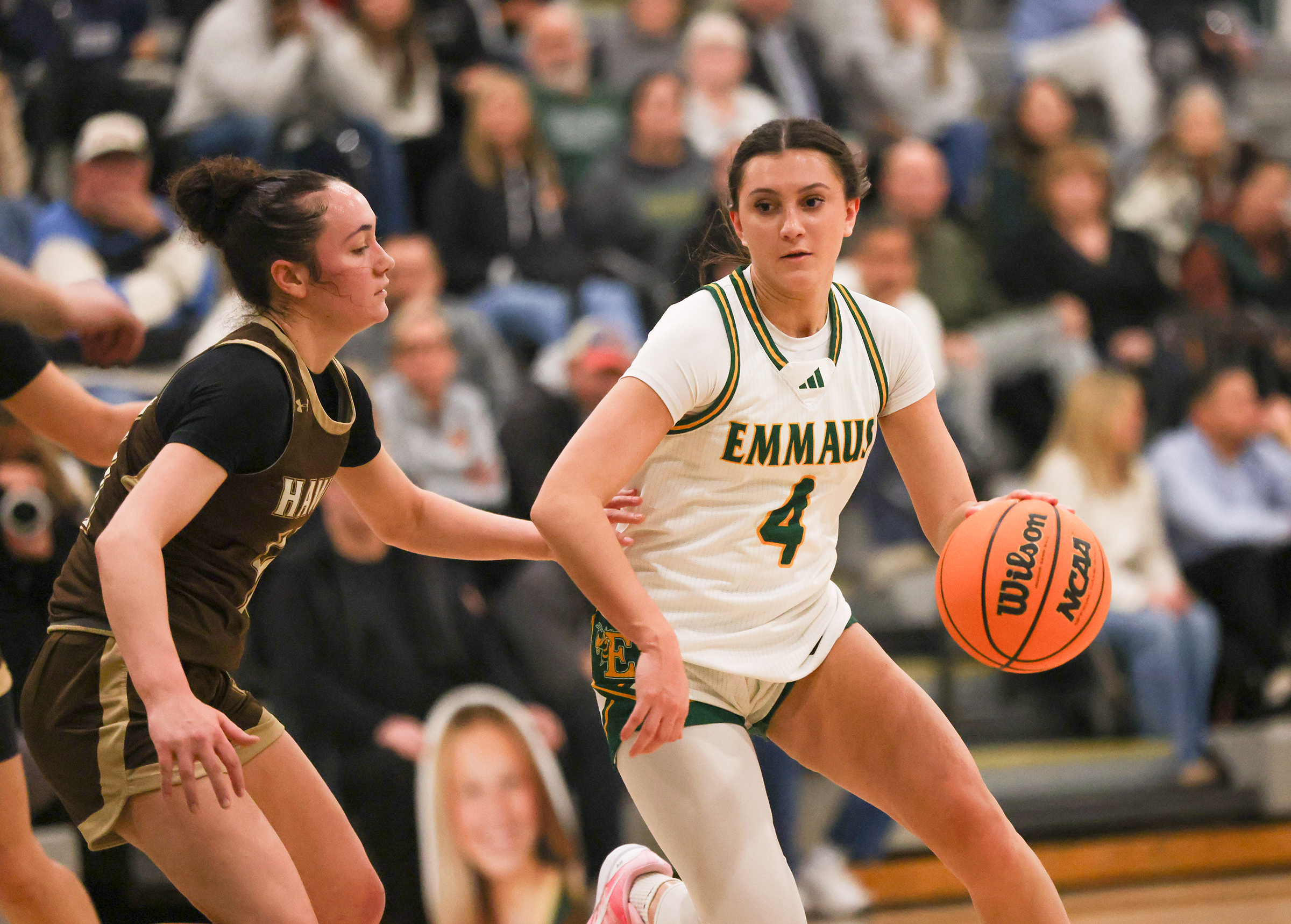 Emmaus player Gabby DeVita (4) tries to dribble the ball past Bethlehem Catholic's Leah Ault (11) during a game against Bethlehem Catholic on Jan. 12, 2026