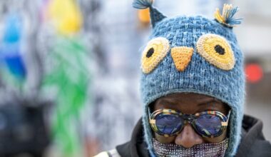 Crossing guard Terri Ashwood shields her head and face from cold winds in November. Those winds are about to get colder this week.