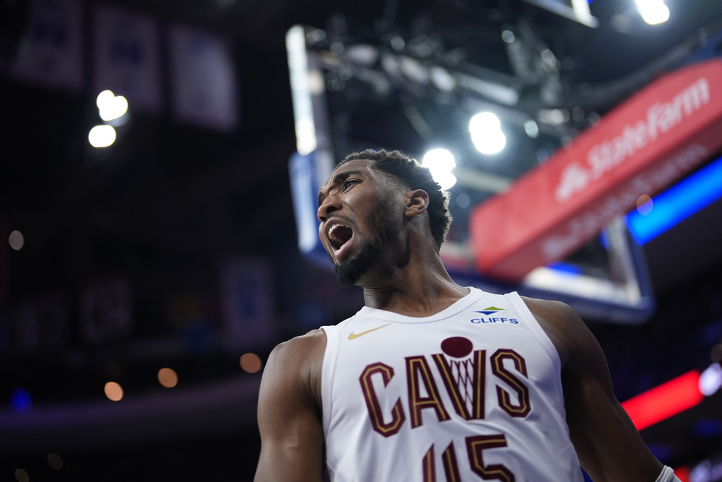 Cleveland Cavaliers' Donovan Mitchell reacts after a basket during the second half of an NBA basketball game against the Philadelphia 76ers Wednesday, Jan. 14, 2026, in Philadelphia. 