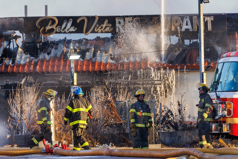 Philadelphia firefighters work at Bella Vista Restaurant, on Whitaker Avenue near Hunting Park Avenue in Philadelphia, Friday, Jan. 16, 2026.