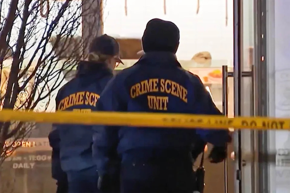 Crime scene officers entering the Chipotle restaurant on Monday evening. (NBC Philadelphia)