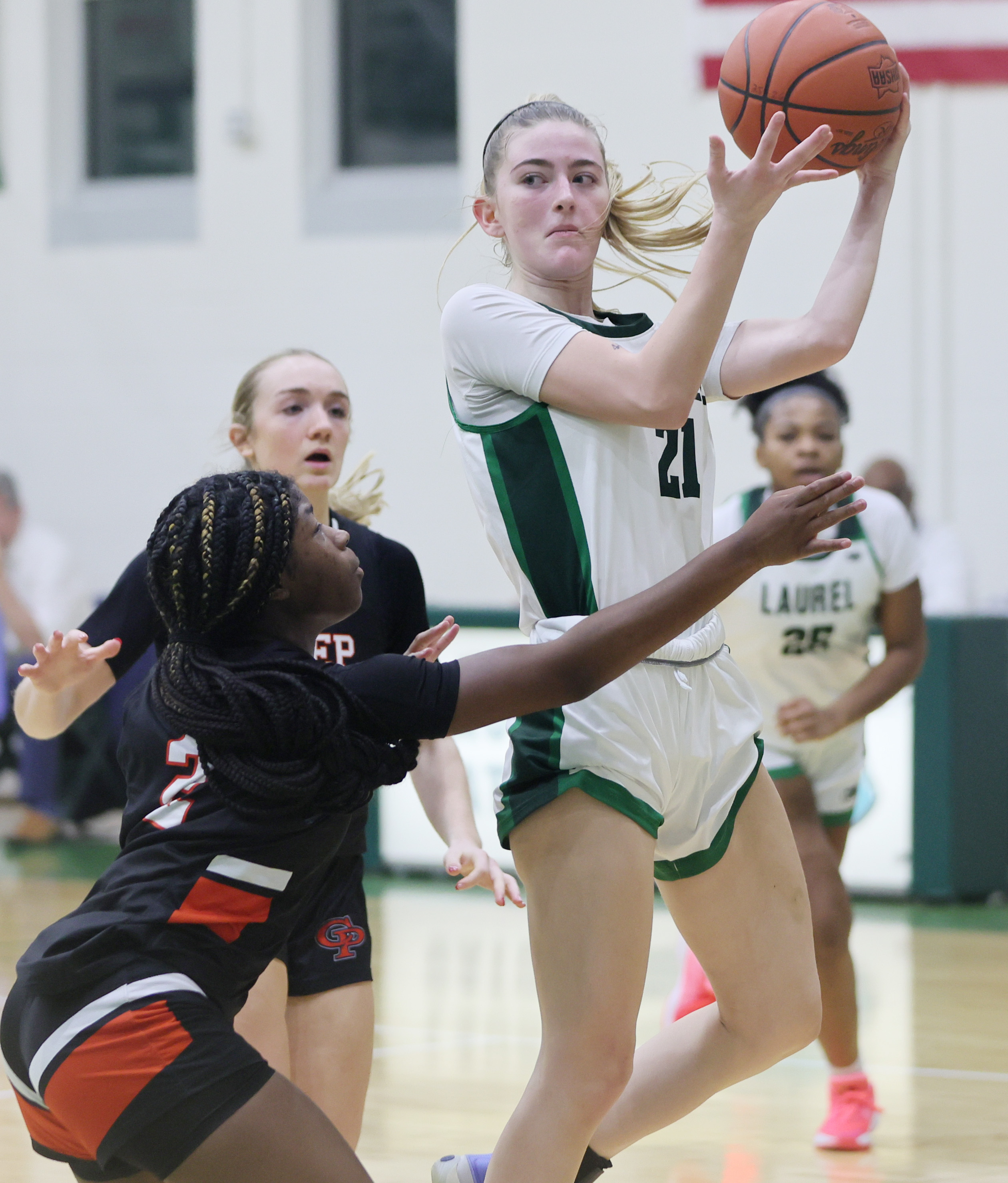 Laurel's Liv Schneider looks to make a pass on a drive to the basket guarded by Cathedral Prep's Seana Thrower in the second half. 