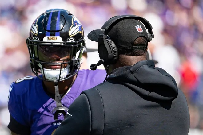 Sep 15, 2024; Baltimore, Maryland, USA; Baltimore Ravens quarterback Lamar Jackson (8) speaks with quarterback coach Tee Martin during the first half against the Las Vegas Raiders at M&T Bank Stadium. Mandatory Credit: Tommy Gilligan-Imagn Images