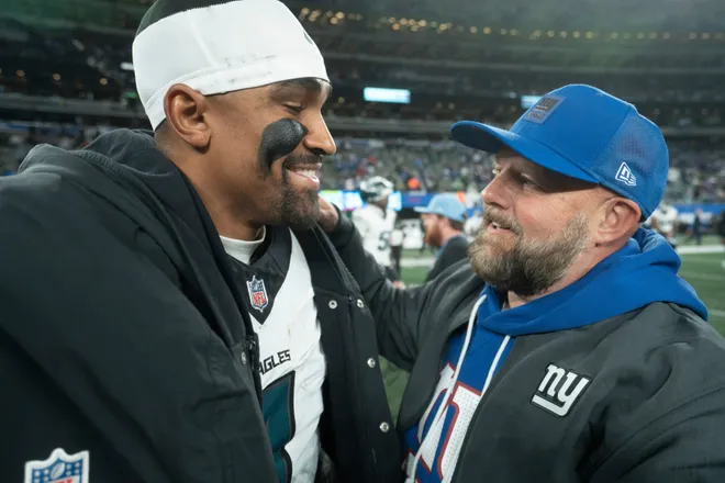Philadelphia Eagles quarterback Jalen Hurts (1) talks with New York Giants head coach Brian Daboll after a Thursday Night Football game between the New York Giants and the Philadelphia Eagles at MetLife Stadium in East Rutherford on Oct. 9, 2025.
