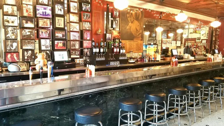 The interior bar area of the Original Oyster House in Pittsburgh glows