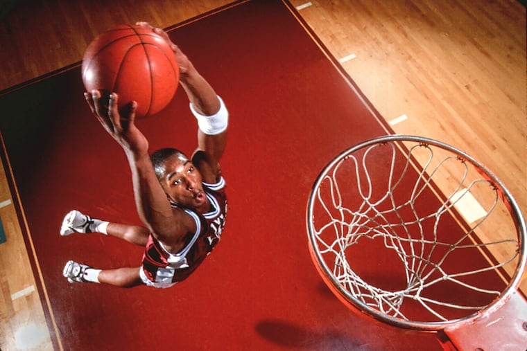 Kobe Bryant goes up for a dunk during an Inquirer photo shoot while he was at Lower Merion High School in 1995.