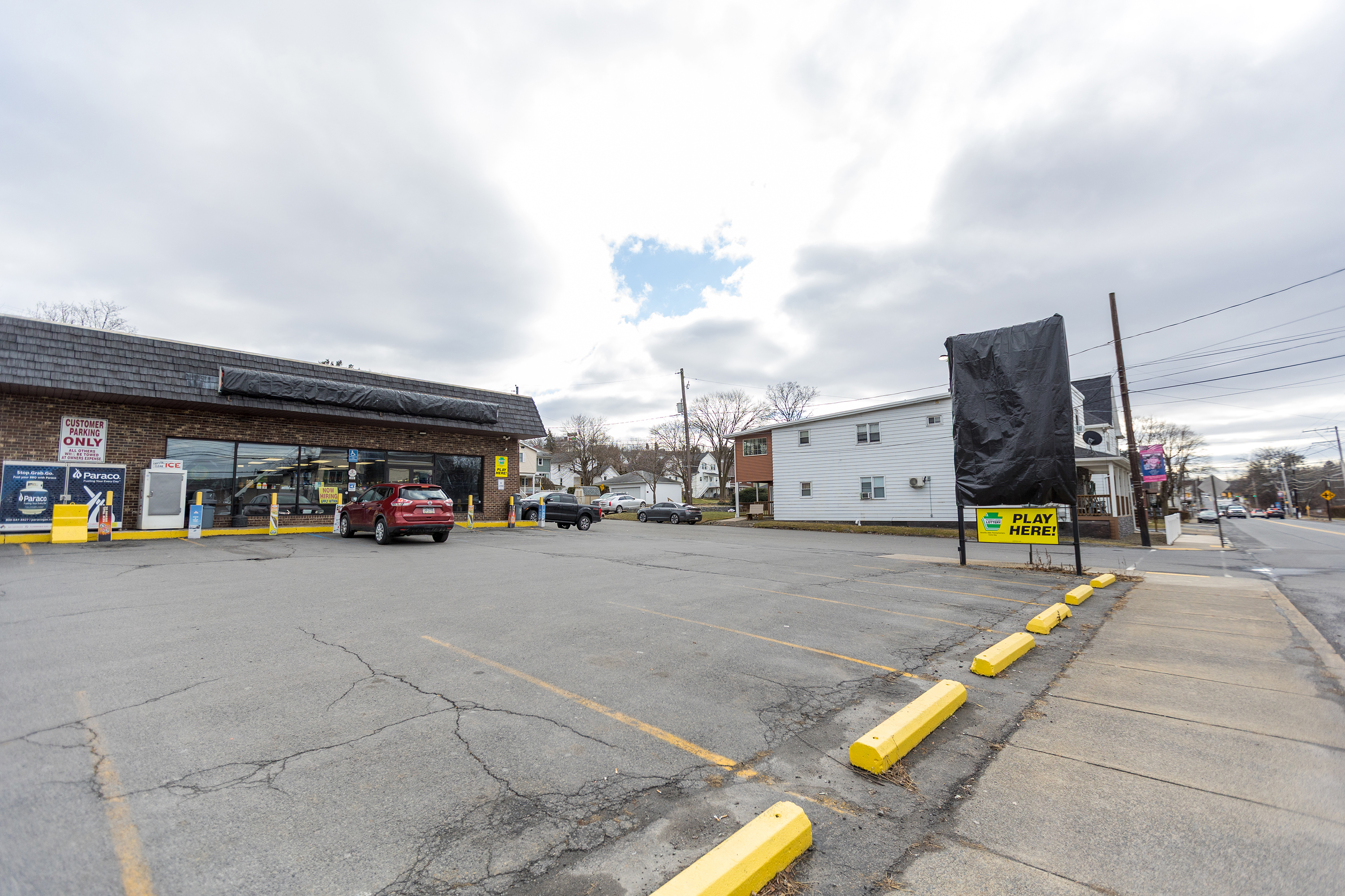 The covered signs of the Convenient Food Mart in Avoca...