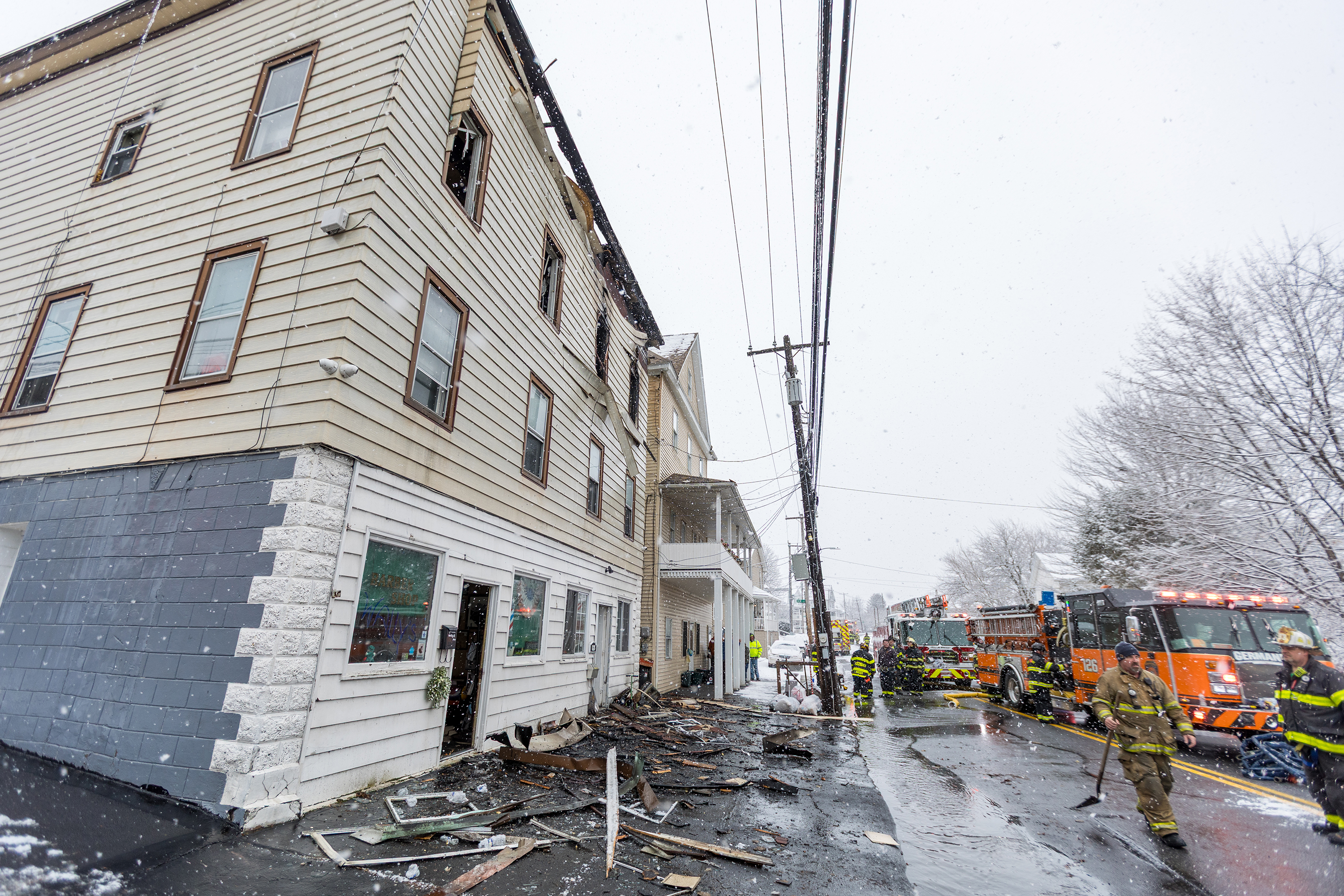 Firefighters work the scene at 628-630 McAlpine St. in Avoca...