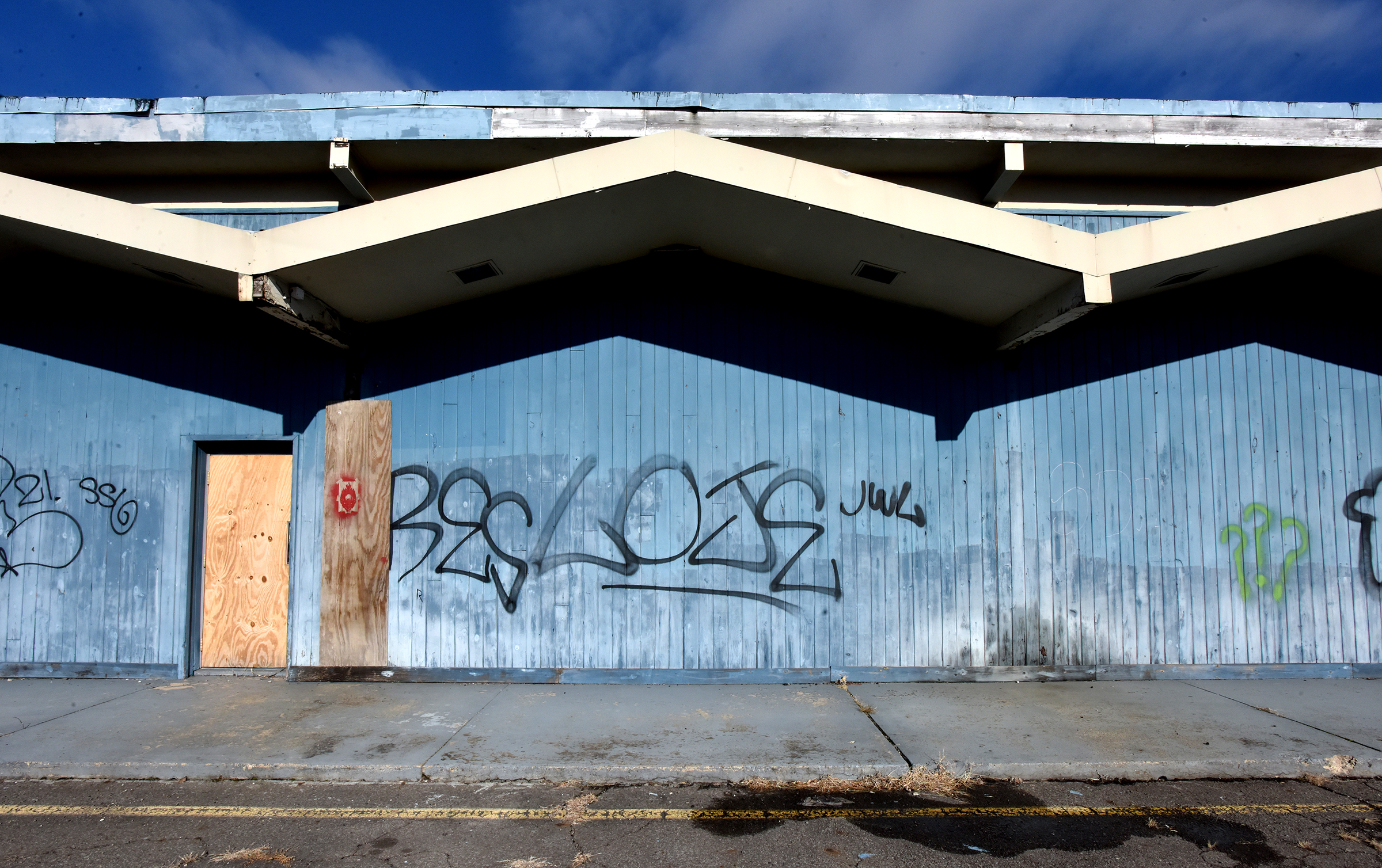 Graffiti covers the side of the former Stanton Lanes bowling alley on Stanton Street in Wilkes-Barre on Thursday, Jan. 9, 2025. The vacant building is owned by Mount Zion Baptist Church. (SEAN MCKEAG / STAFF PHOTOGRAPHER)