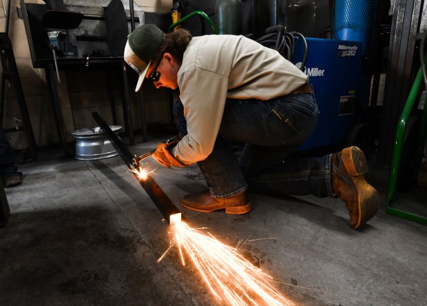 West Side Career and Technology Center student James King cuts a piece of metal during the District 1 SkillsUSA Regional Competition held at Luzerne County Community College in Nanticoke Thursday, January 8, 2026. (SEAN MCKEAG / STAFF PHOTOGRAPHER)