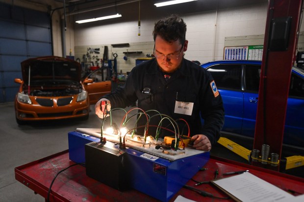 Carbon Career and Technical Institute student Lucas Miller diagnoses a series of parallel circuits in the automotive department during the District 1 SkillsUSA Regional Competition held at Luzerne County Community College in Nanticoke Thursday, January 8, 2026. (SEAN MCKEAG / STAFF PHOTOGRAPHER)