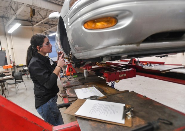 Lackawanna Trail and Susquehanna County Career & Technology Center student Caley Ryan works on a vehicle during the District 1 SkillsUSA Regional Competition held at Luzerne County Community College in Nanticoke Thursday, January 8, 2026. (SEAN MCKEAG / STAFF PHOTOGRAPHER)