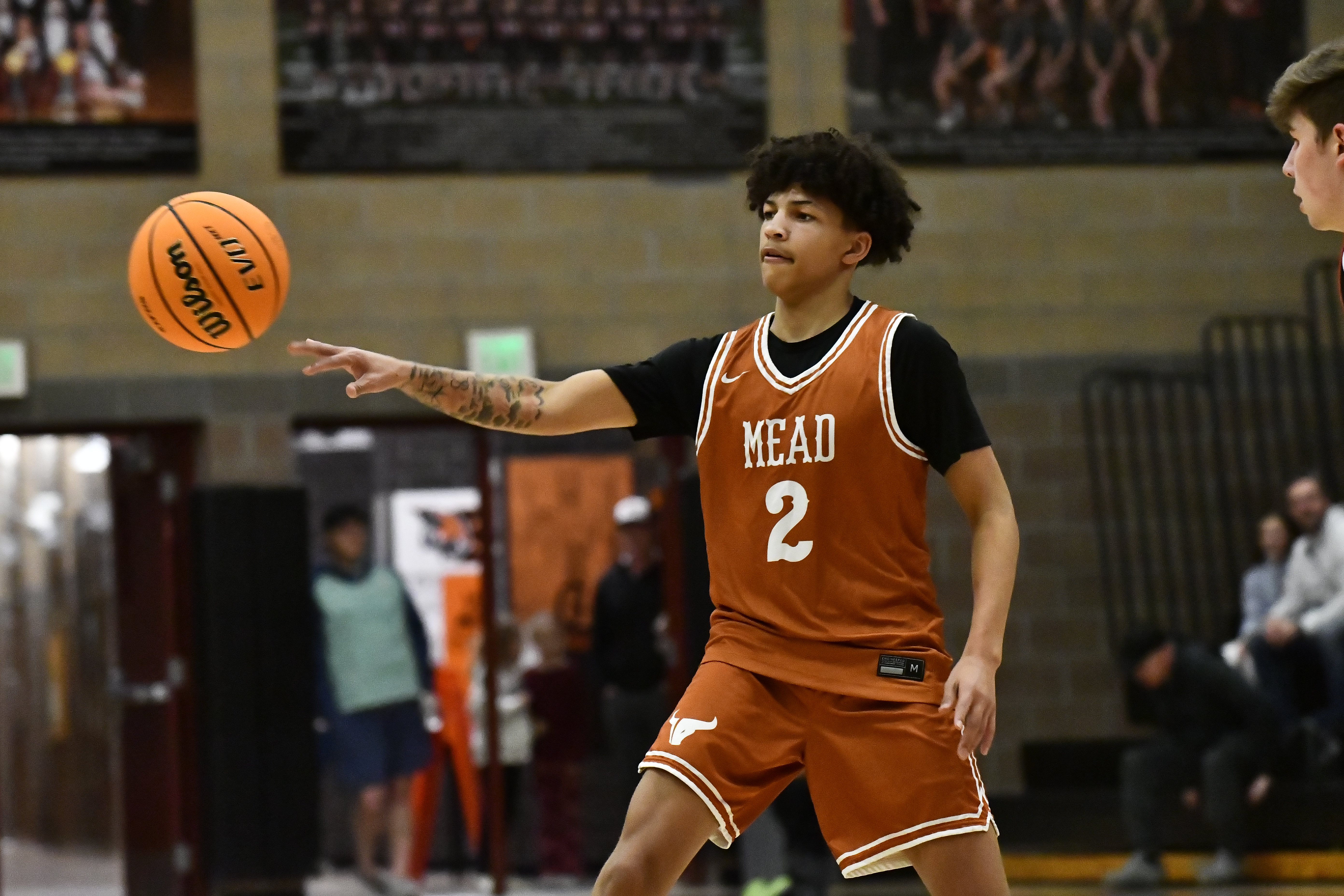 Mead's Seth Coet makes a pass during the Mavericks' game...