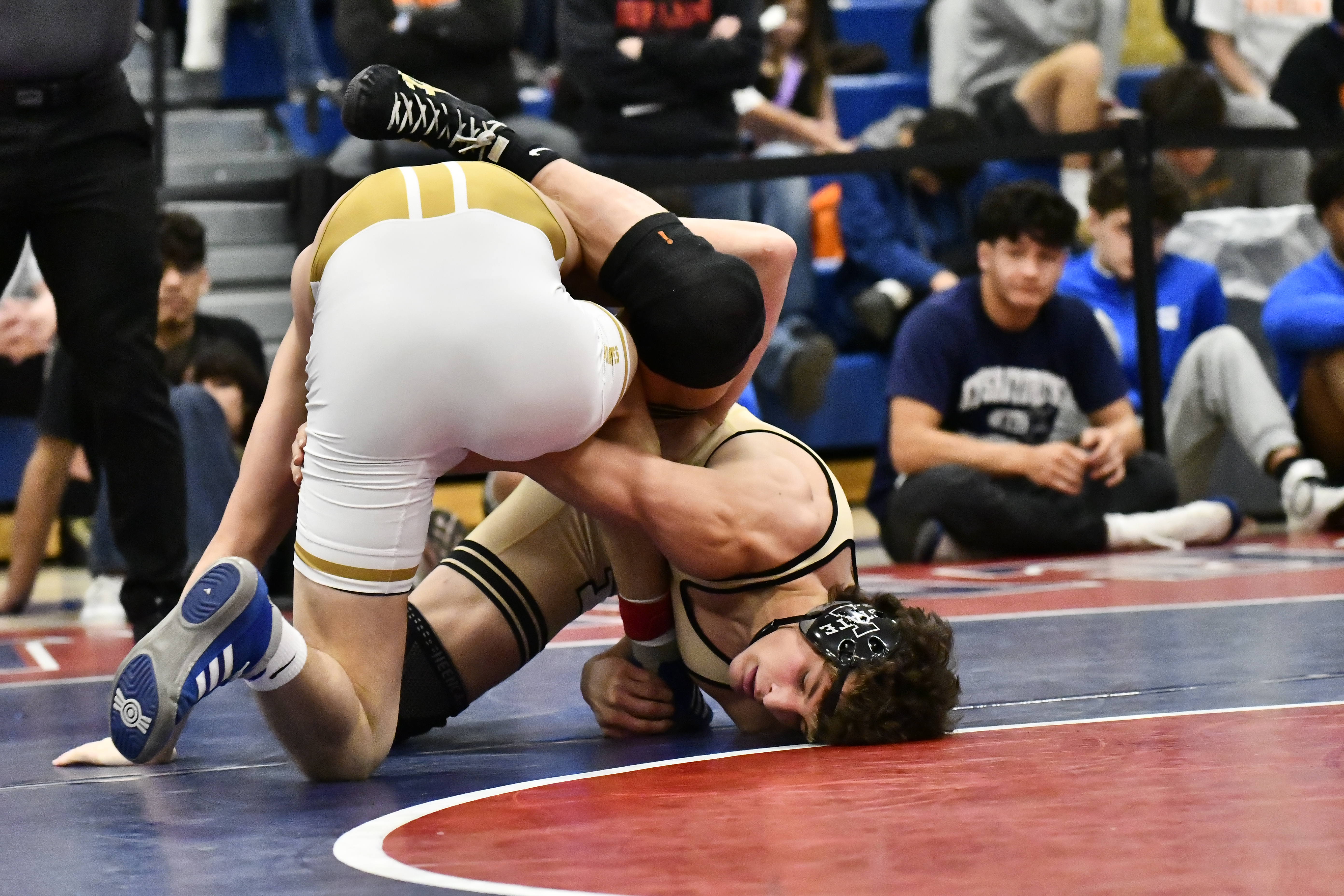 Monarch's Levi Carlucci wrestles against Grandview's Gunner Lopez during the...