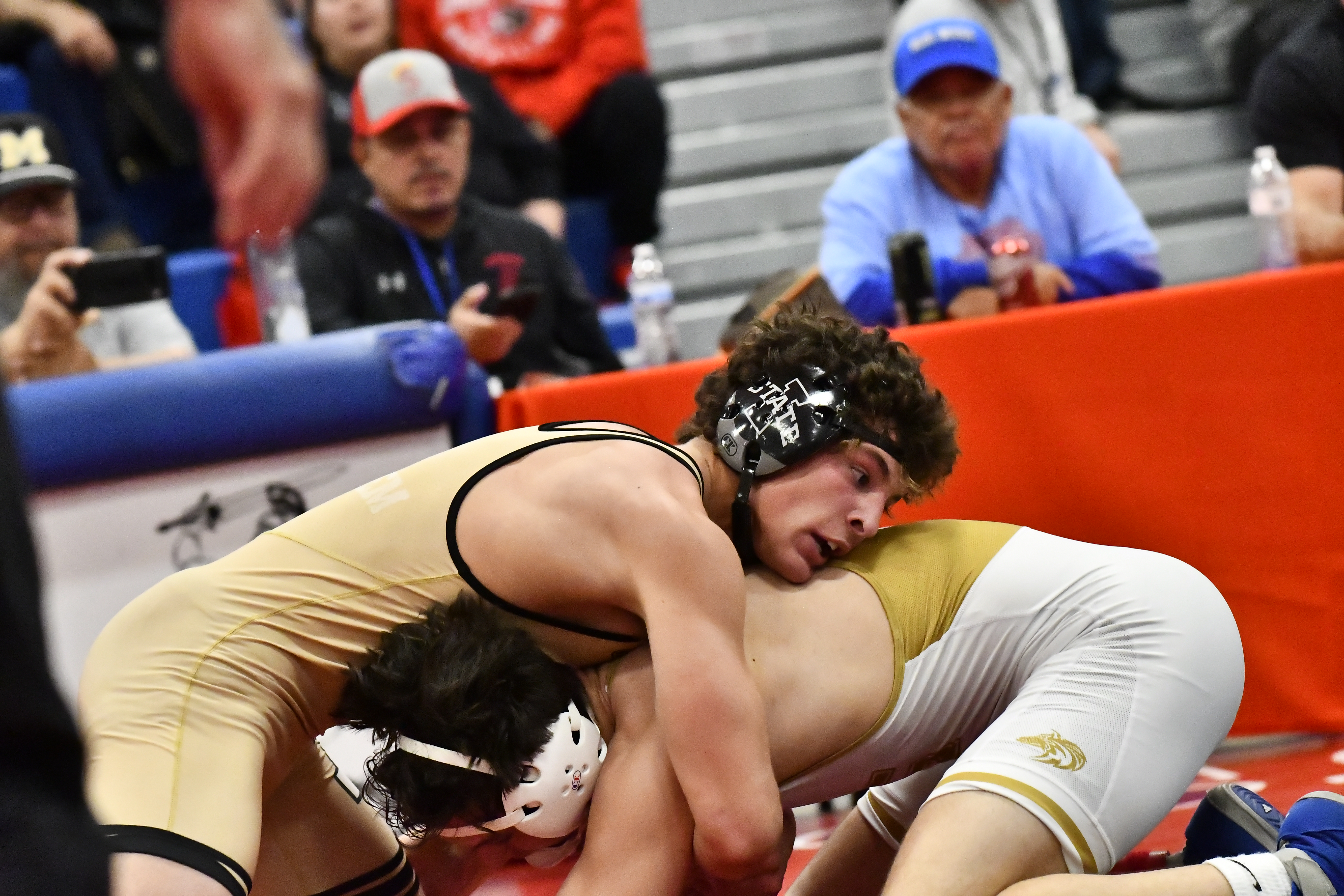 Monarch's Levi Carlucci wrestles against Grandview's Gunner Lopez during the...