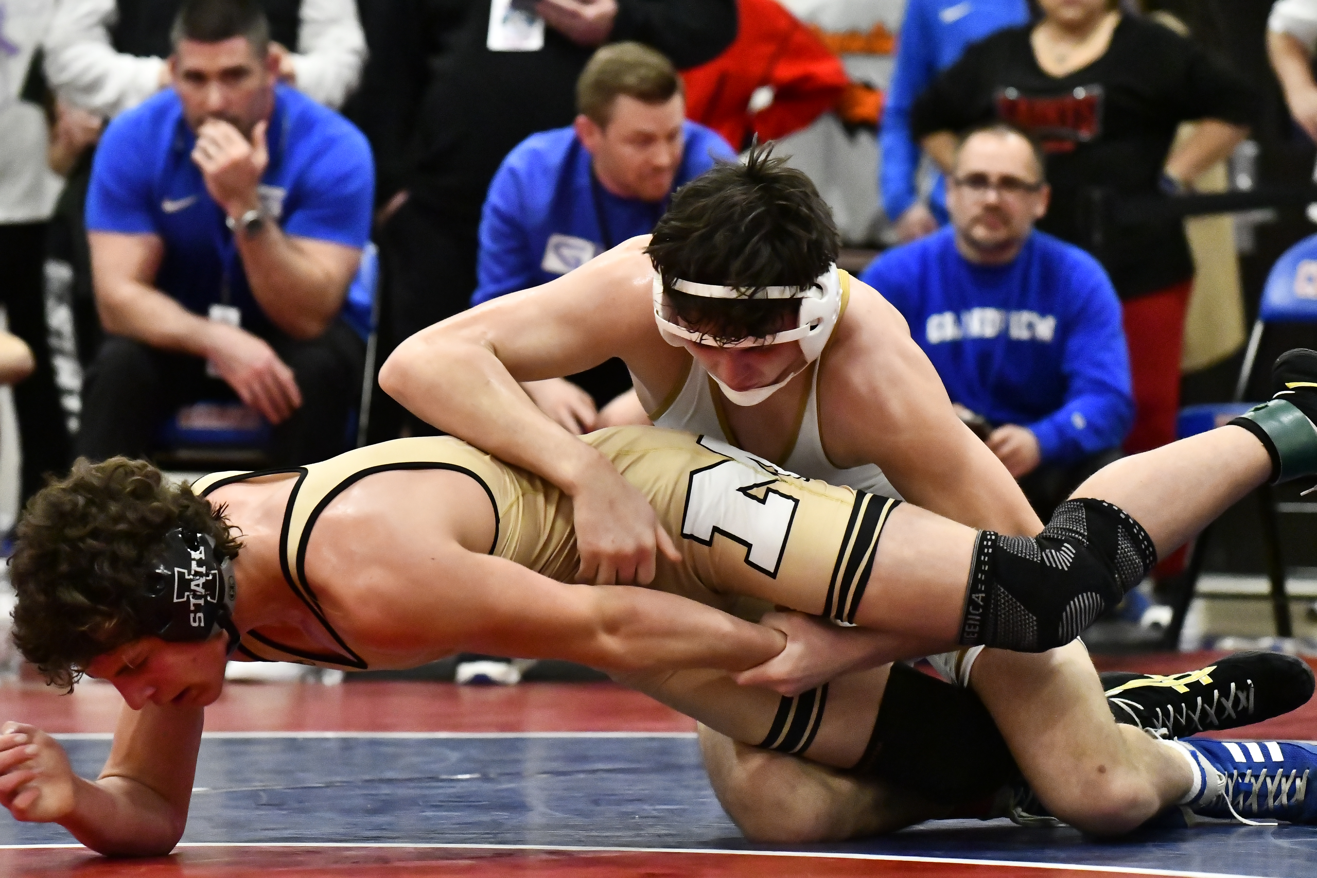 Monarch's Levi Carlucci wrestles against Grandview's Gunner Lopez during the...
